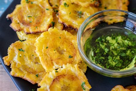 Traditional Dominican Green And Yellow Fried Plantains With Mojo Sauce