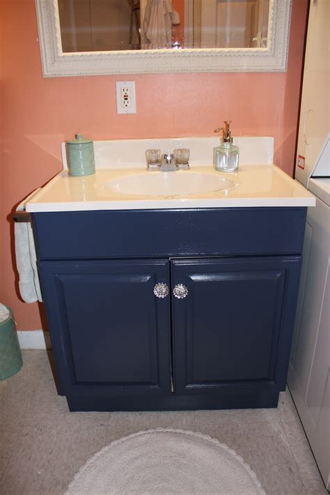 Do you want to update your bathroom cabinets? The Elegant House: Painting a Laminate Bathroom Vanity