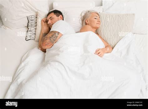 Mature Couple Sleeping In Bed Stock Photo Alamy