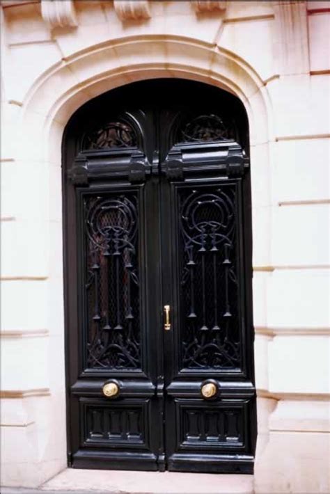 Glossy Black Double Exterior Doors With Fanlight Of Arrows