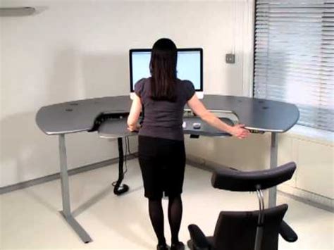 Motorized height adjustable desks make life easier.if you are struggling with back pain or having a hard time sitting for prolonged periods at work, then an adjustable standing desk (sometimes referred to as a stand up desk) may be the answer. Biomorph Maxo Series Motorized Standing desk - YouTube
