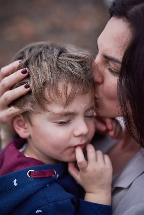 Tender Motherly Love A Mother Embracing Her Little Son Stock Photo