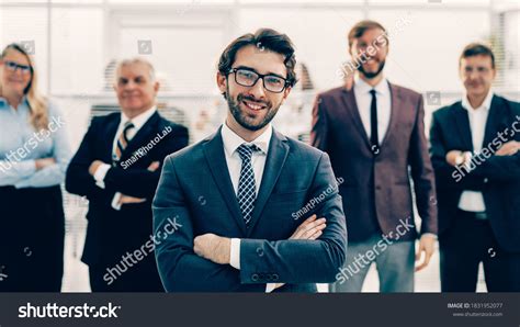 Confident Employee Standing Front His Colleagues Stock Photo 1831952077