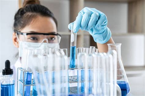 Biochemistry Laboratory Research Chemist Is Analyzing Sample In Laboratory With Equipment And