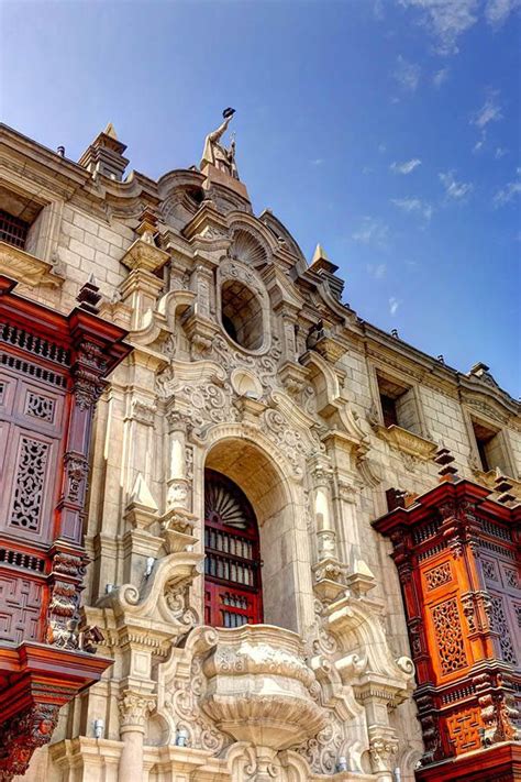 An Old Building With Ornate Carvings On The Front And Side Walls