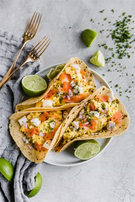 Smoked salmon breakfast bagel filled with cream cheese, fresh tomato, scrambled egg and smoked salmon and topped with fresh dill. Smoked Salmon Breakfast Tacos | Well Seasoned Studio