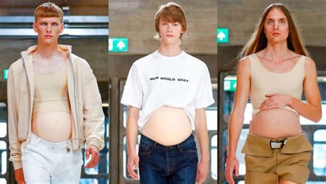 male models walk the ramp with fake pregnant bellies in london view