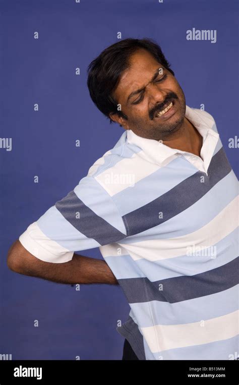 Mature Indian Man With Back Pain Stock Photo Alamy