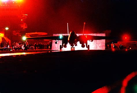 An F 14 Tomcat Engages Its Afterburners Prior To A Night Launch Off