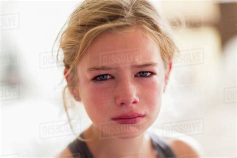 Close Up Of Red Face Of Crying Caucasian Girl Stock Photo Dissolve