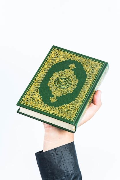Premium Photo Koran In Hand Holy Book Of Muslims Public Item Of All