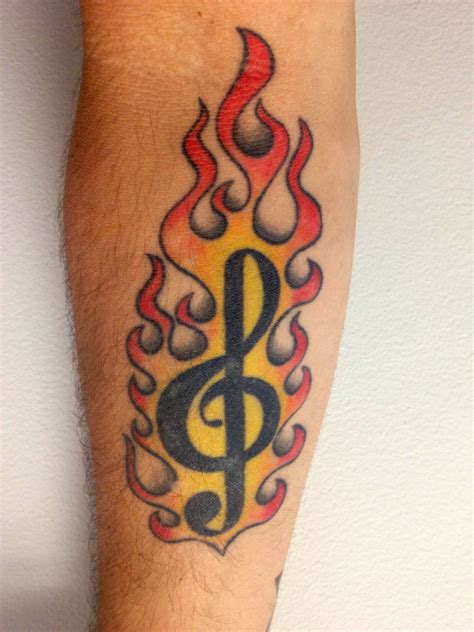 Explore cool musical themed ink ideas with auditory delight. Flaming treble clef music tattoo | Tattoos, Music tattoo, Music tattoo designs