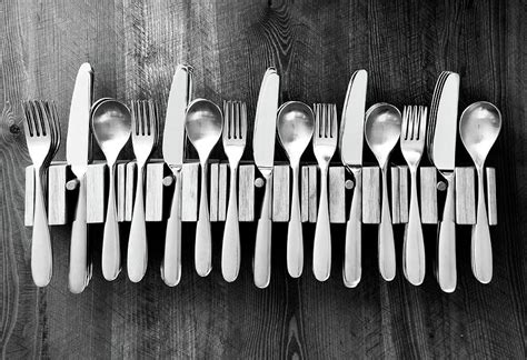 lots of knives forks and spoon in cutlery holders photograph by gill copeland fine art america
