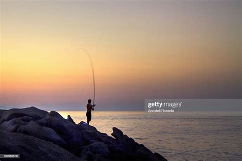 Fisherman At Sunset High Res Stock Photo Getty Images