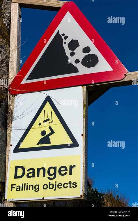 A Warning Or Advisory Sign Informing People Of The Dangers Of Falling
