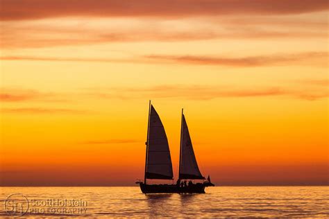 Sailboat Silhouette With The Sunset Afterglow In The Gulf