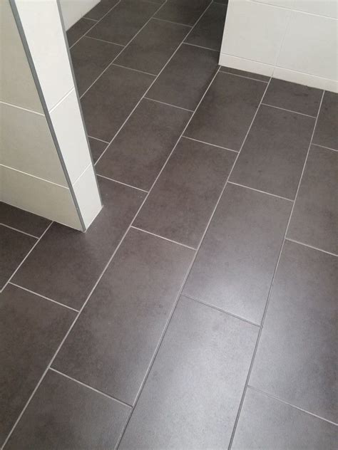 These are the middle ground for our grouts, and can really pull dark or light, depending on what they are paired with. Light Gray grout in 2019 | Grey grout, Tile design, Tiles