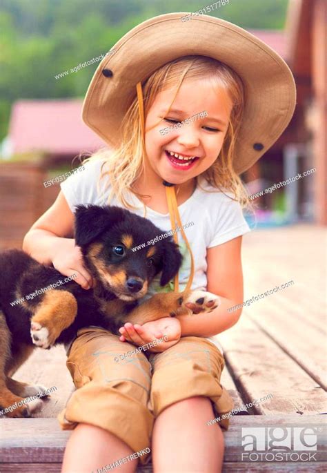 Cute Little Girl Hugging Dog Puppy Friendship And Care Concept Stock