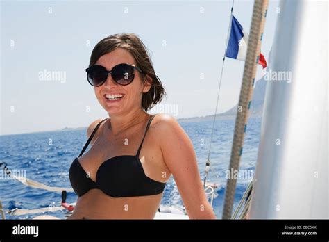 Smiling Woman Sitting On Sailboat Stock Photo Alamy