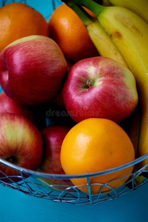 Metal Fruit Bowl On A Wooden Surface Close Bananas Oranges And
