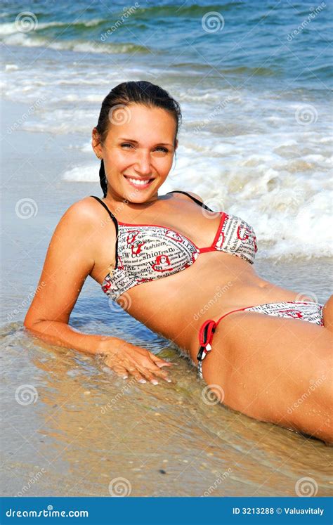 Women Lies On The Sea Beach Stock Photo Image