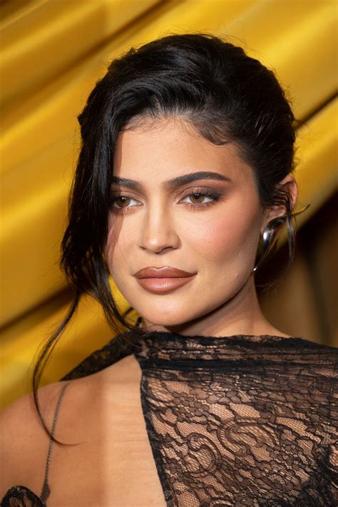 kylie jenner wears sheer cutout lace dress making her bare skin part of the design