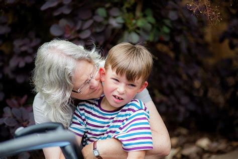 Grandmother Hugging Grandson Photograph By Samuel Ashfield