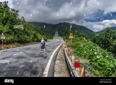A Motorcycle Rider Climbing The Hai Van Pass In Central Vietnam Stock