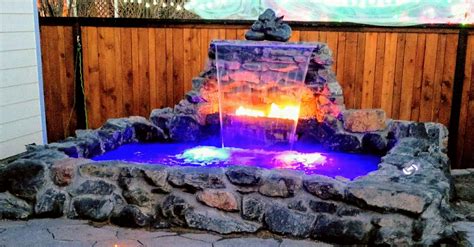 Custom Hot Tub With Fire Feature And Waterfall Designed And Built By