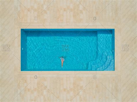 Aerial View Of Girl Diving Into Swimming Pool Sumartin Croatia Stock