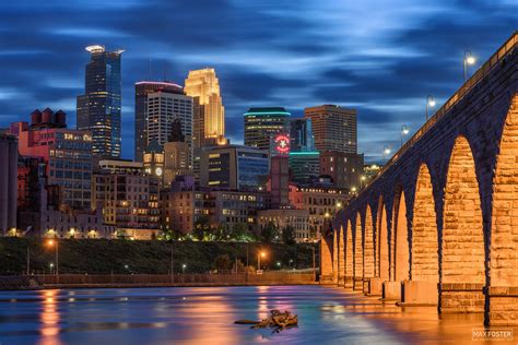 Minneapolis Skyline The Stone Arch Bridge And The Mississippi River