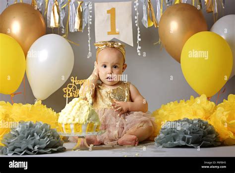 Adorable And Cute Girl In Beautiful Dress Crying On Her First Birthday