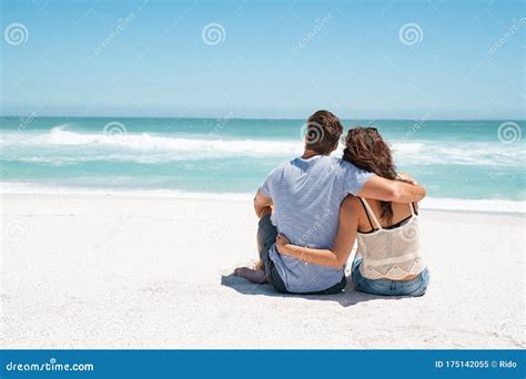 Couple Embracing And Sitting On Beach Stock Image Image Of Horizon Holiday 175142055
