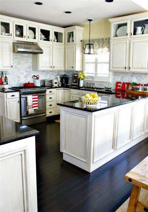 The attraction of creating distressed black kitchen cabinets is that it's an easy way to give a rustic look to your kitchen. Distressed Kitchen Cabinets: How To Distress Your Kitchen ...