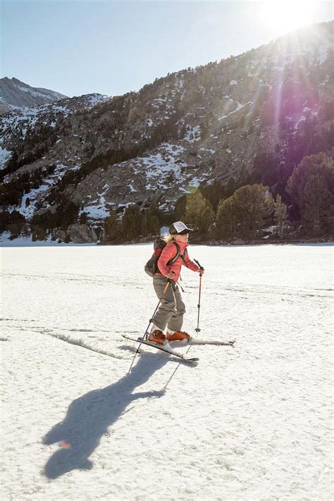 A Young Girl Skiing On A Frozen Lake Photograph By Kennan