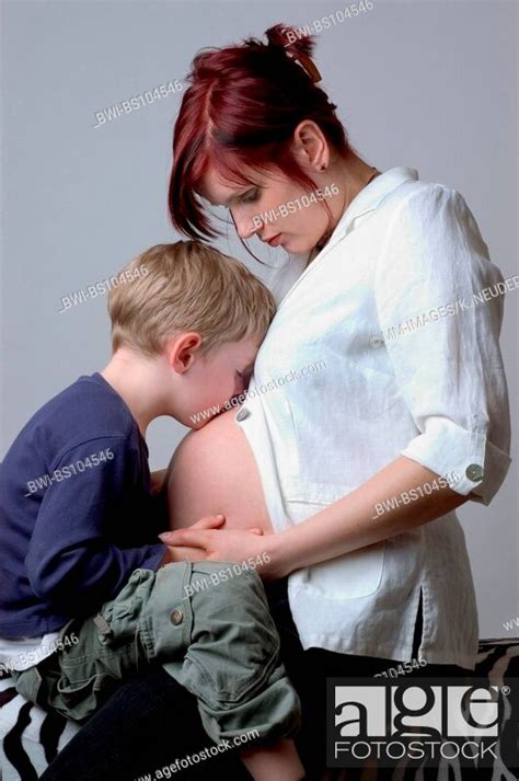 Portrait Of An Pregnant Mother With Her Son Stock Photo Picture And