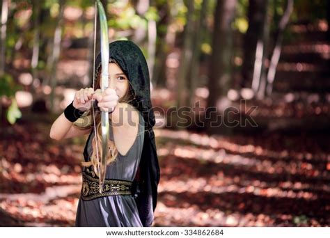 Girl Dressed Archer Pointing Bow Arrow Stock Photo 334862684 Shutterstock
