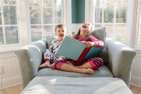 Big Sister Reading A Book For Little Brother By Jakob Lagerstedt