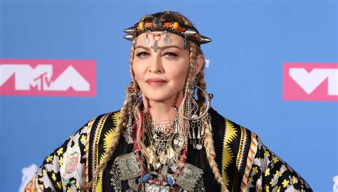 In the pictures it looks like the photoshop artist altered her skin color. Meet Madame X, Madonna's New Alter Ego - DailyPopStar