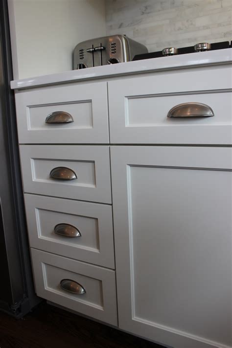 On the top drawer we centered it and then for the two drawers below (which are bigger), we put the pull the same distance down from the top as the top drawer. Cabinet Refacing in Glen Ellyn - Kitchen Craftsman ...
