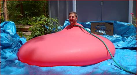 A Man Gets Inside A Giant Water Balloon And Fills It Till It Pops In Slow Motion Mind Detour