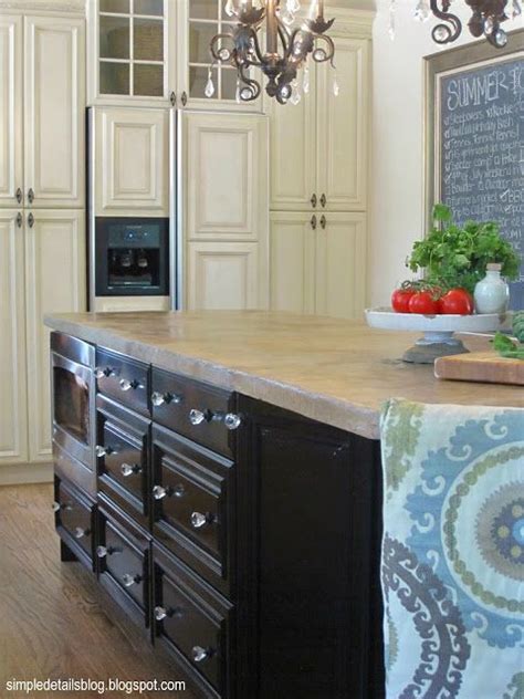 The kitchen is small, has black appliances, and high gloss paint on the cabinets.it looks like a black hole! To get these high gloss black cabinets for her kitchen island, she had her local auto body shop ...