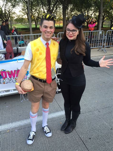 A Man And Woman Dressed Up In Costumes