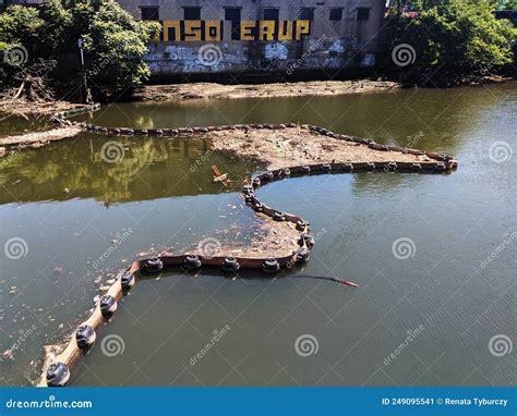 Floating Barrier With Trapped Trash On The River Pollution Of Water