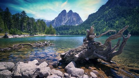 Lake With Clear Water And Stones In Background Of Mountain 4k Hd Nature
