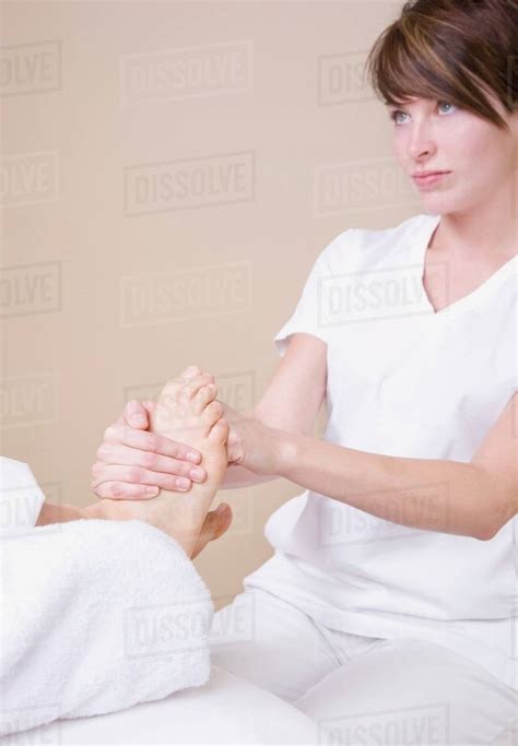 Feet Being Massaged By A Massage Therapist Stock Photo Dissolve