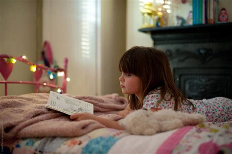 Girl Laying On Her Bed Reading Del Colaborador De Stocksy Christina K Stocksy