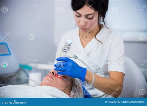 Cosmetology Clinic A Client Taking Procedure A Woman Cosmetologist