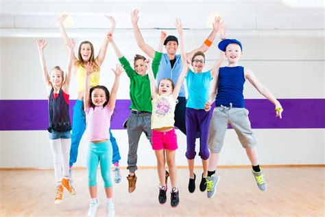 They love to dance and have fun. Dance teacher giving kids Zumba fitness class - FOCUS ...
