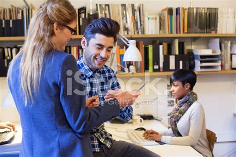 Young People Using Digital Tablet At Startup Stock Photo Royalty Free